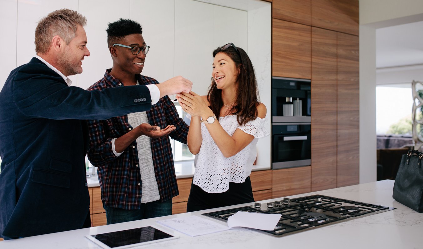 Realtor Giving Keys to New Property Owners